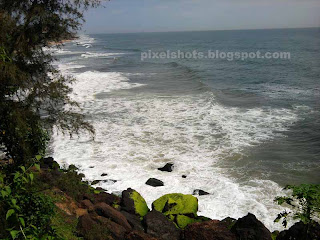 varkala beach from mountain cliffs white sea waves of arabian sea,varkala beach photos,cliff top view of varkala beaches and arabian sea