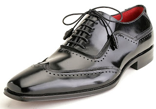 black leather shoe with white background