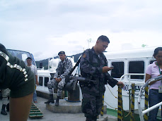 Guarding the fast boat from Masbate to Pilar - The Philippines November 2007