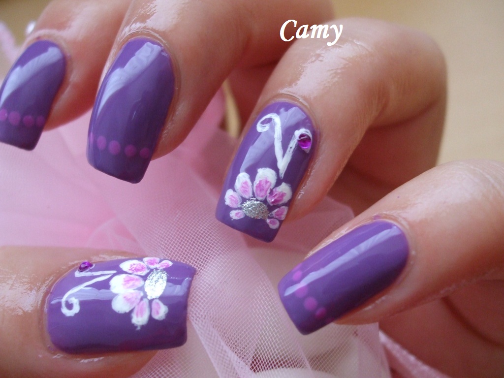 White flower on purple nails Camy's Beauty Corner