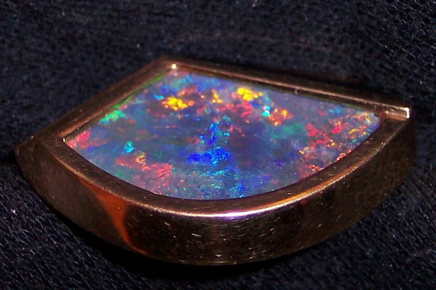 Gems of Michigan Australian boulder opals and Chlorastrolite