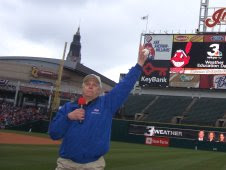 Tom Benson directs students to watch his modeling program on the Indians' scoreboard.