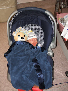 Baby Collin in his Air Evac hat and Prayer Bear