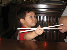 Caleb using chop sticks