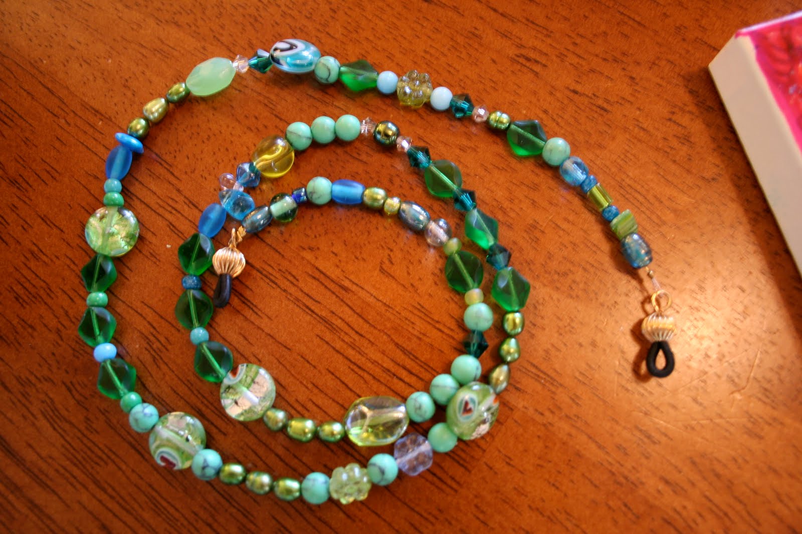 two custom made reading glasses chains. in hand-decorated jewelry boxes, two custom made reading glasses chains. in hand-decorated jewelry boxes,