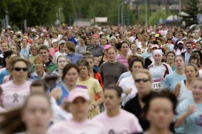 A sea of Run for Women participants crowds 16th Avenue in Anchorage.