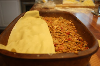 Layering the lasagna ingredients