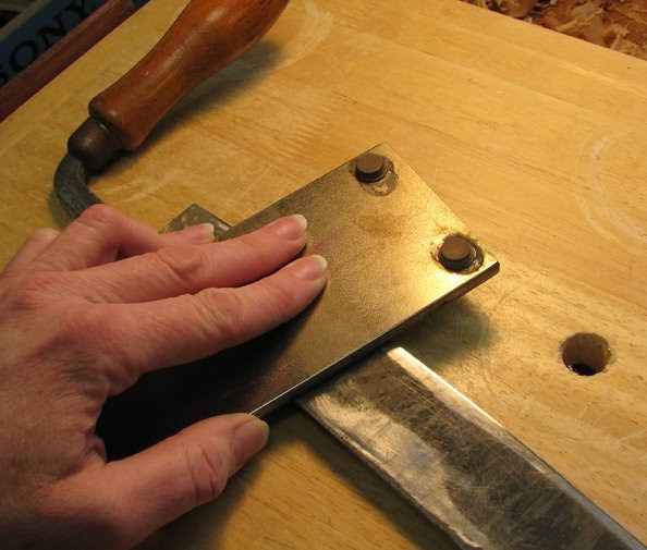 The Village Carpenter Sharpening a Drawknife