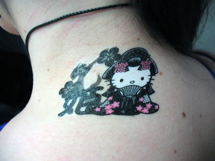  got a nice Hello Kitty tattoo on my neck for when I put my hair up.