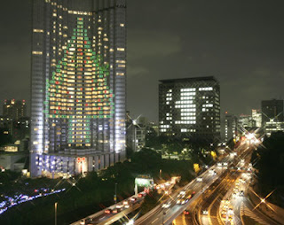 A 100-meter tall Christmas tree on the wall of a Tokyo hotel