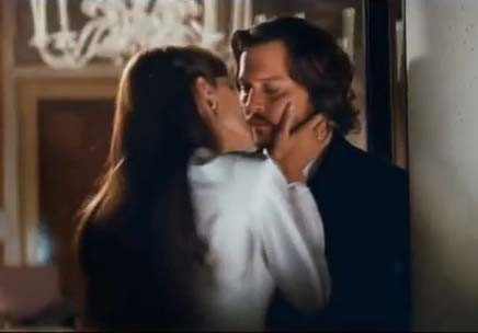 Angelina Jolie kissing Johnny Depp while filming The Tourist photo_credit