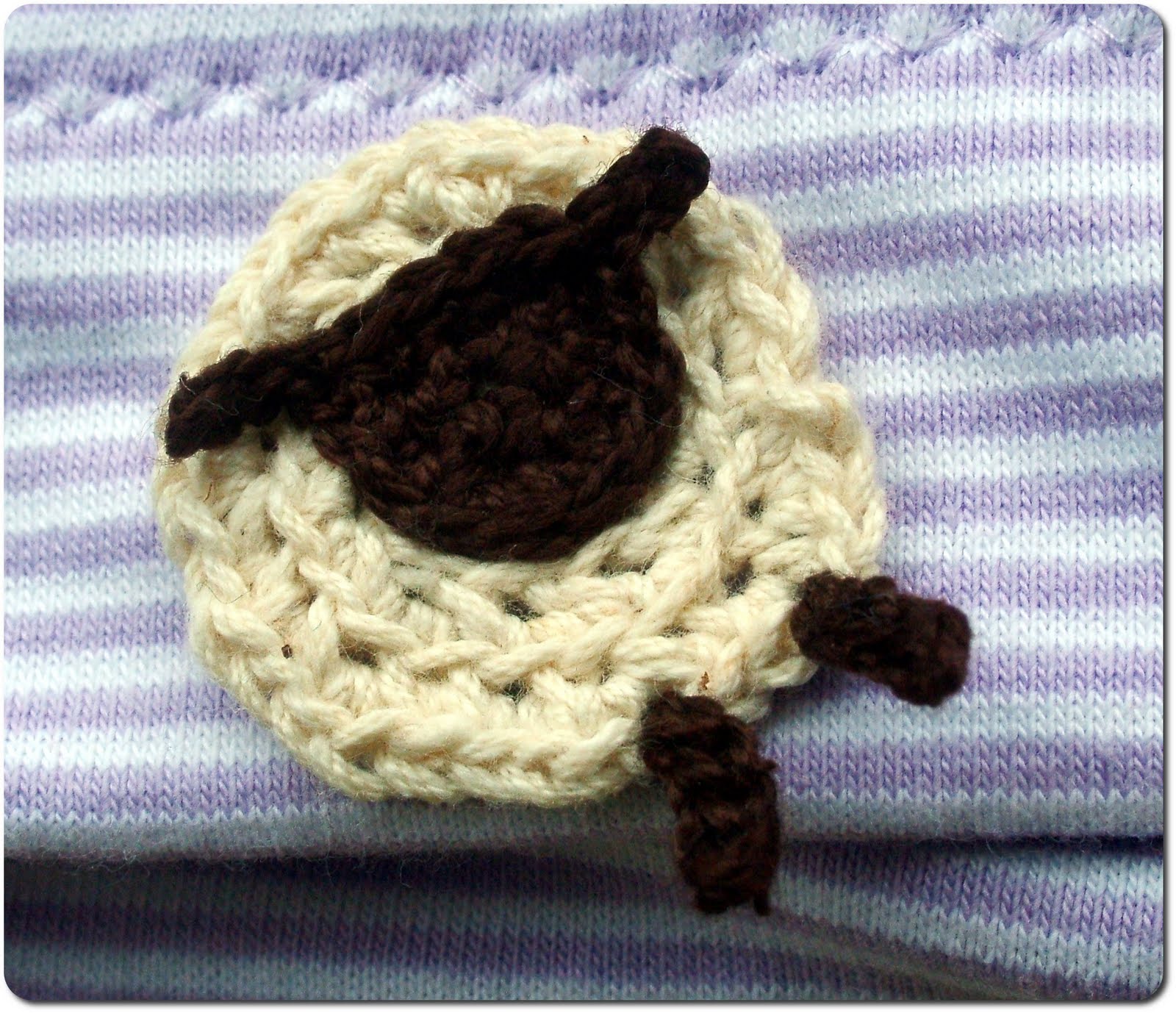 Muffins and More: Baby hat with crocheted sheep applique