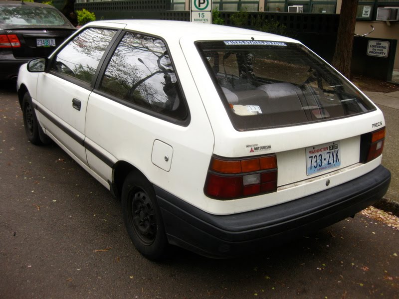 OLD PARKED CARS. 1990 Mitsubishi Precis Hatchback.