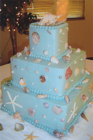 Stunning round four tier light blue wedding cake shaped to look as though Stunning round four tier light blue wedding cake shaped to look as though