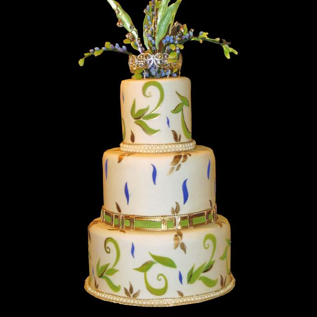 Gold purple and green hand painted wedding cake a row of pearls lines each Gold purple and green hand painted wedding cake a row of pearls lines each