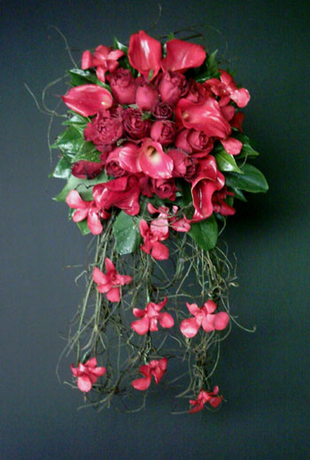 Red roses calla lilies and re orchids cascading wedding bouquet Red roses calla lilies and re orchids cascading wedding bouquet