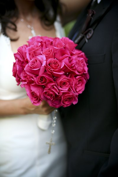 Bright Pink Rose bridal bouquet The pink roses stems are wrapped in white Bright Pink Rose bridal bouquet The pink roses stems are wrapped in white