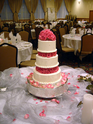  white buttercream lightly patterned with small sugar balls wedding cake