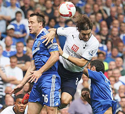 Jonathan Woodgate (right) of Tottenham Hotspur and John Terry of Chelsea challenge for the ball in the air. Spurs held on for a 1-1 draw and their first point of the season.