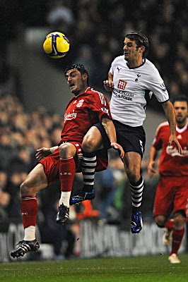 Albert Riera (left) of Liverpool and David Bentley of Tottenham compete for a header during their Barclays Premier League match at White Hart Lane in London, England.