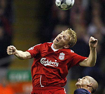 Liverpool forward Dirk Kuyt wins a header from Atletico Madrid defender Mariano Pernia during their Champions League Group D match at Anfield, Liverpool, north-west England, on November 4, 2008