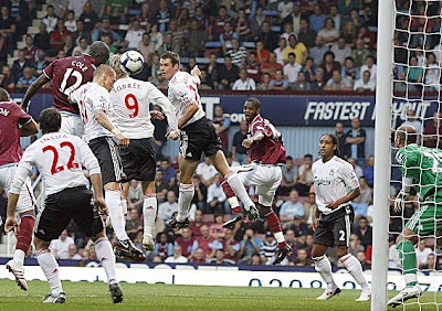 West Ham striker Carlton Cole (center) scores West Ham's second goal against Liverpool.