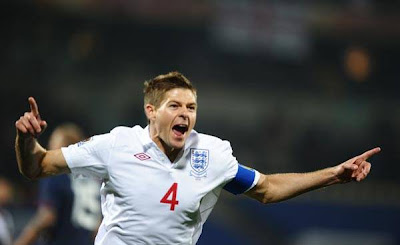 England's midfielder Steven Gerrard celebrates after scoring the opening goal against USA.