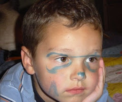 Greyson paints his own face!