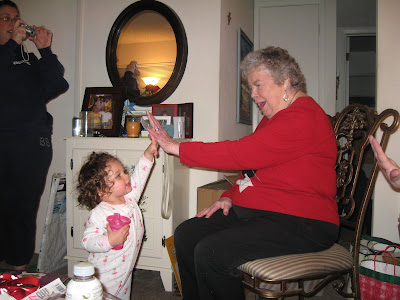 16 month old Kaitlyn giving Gigi a high 5