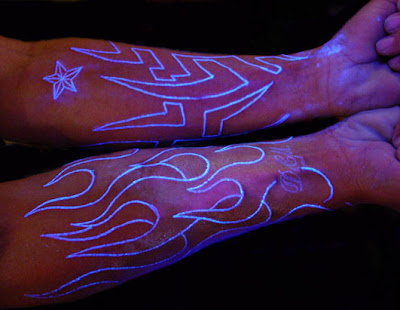 An amazing black light tattoo done on the back of the body.