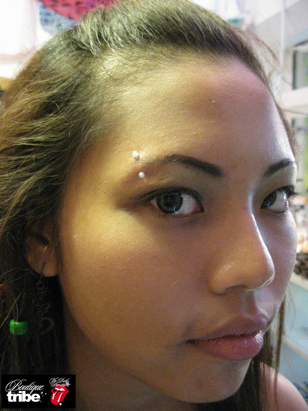 Eyebrow piercing title=