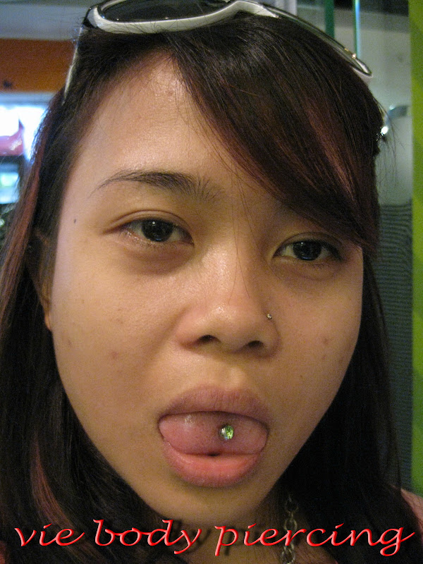 Tongue piercing title=