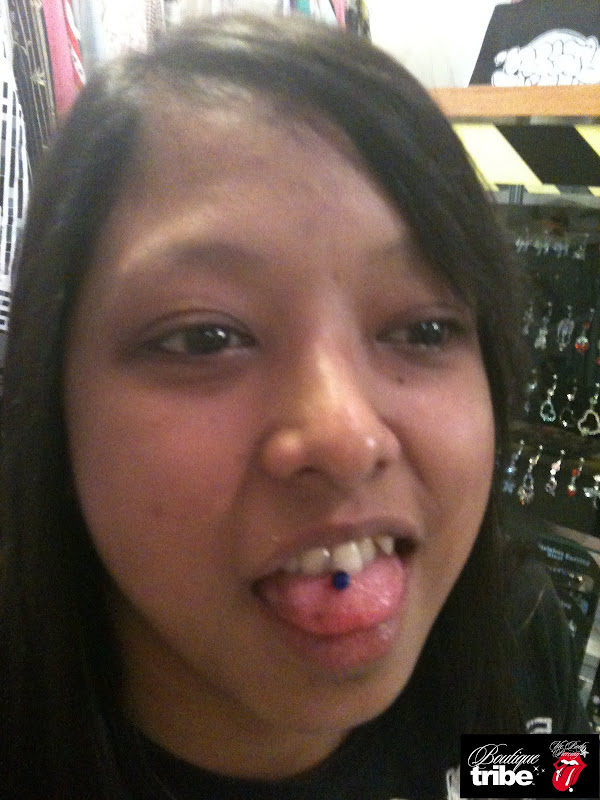 Tongue piercing title=