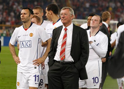 alex ferguson looks on disconsolate as barcelona collect the champions league trophy