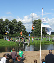 Pole Vaulting Over the Canal