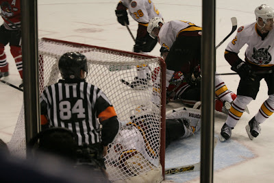 Credit: Jane Rickard, I love this image, Brian Sipoz is holding the Hog down and looking after Pavlec. Sterling and Fahey are keeping track of the puck.