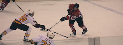 Credit:Partick Kissane, a healthy Grant Lewis passes the puck..