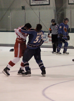Credit: Patrick Kissane, Myles Stoesz, defending an Atlanta player after a bording incident during the first period.