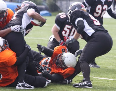 Credit:Jane Rickard, Still fighting it takes three Detroit players to take the Force carrier down, thats heart.