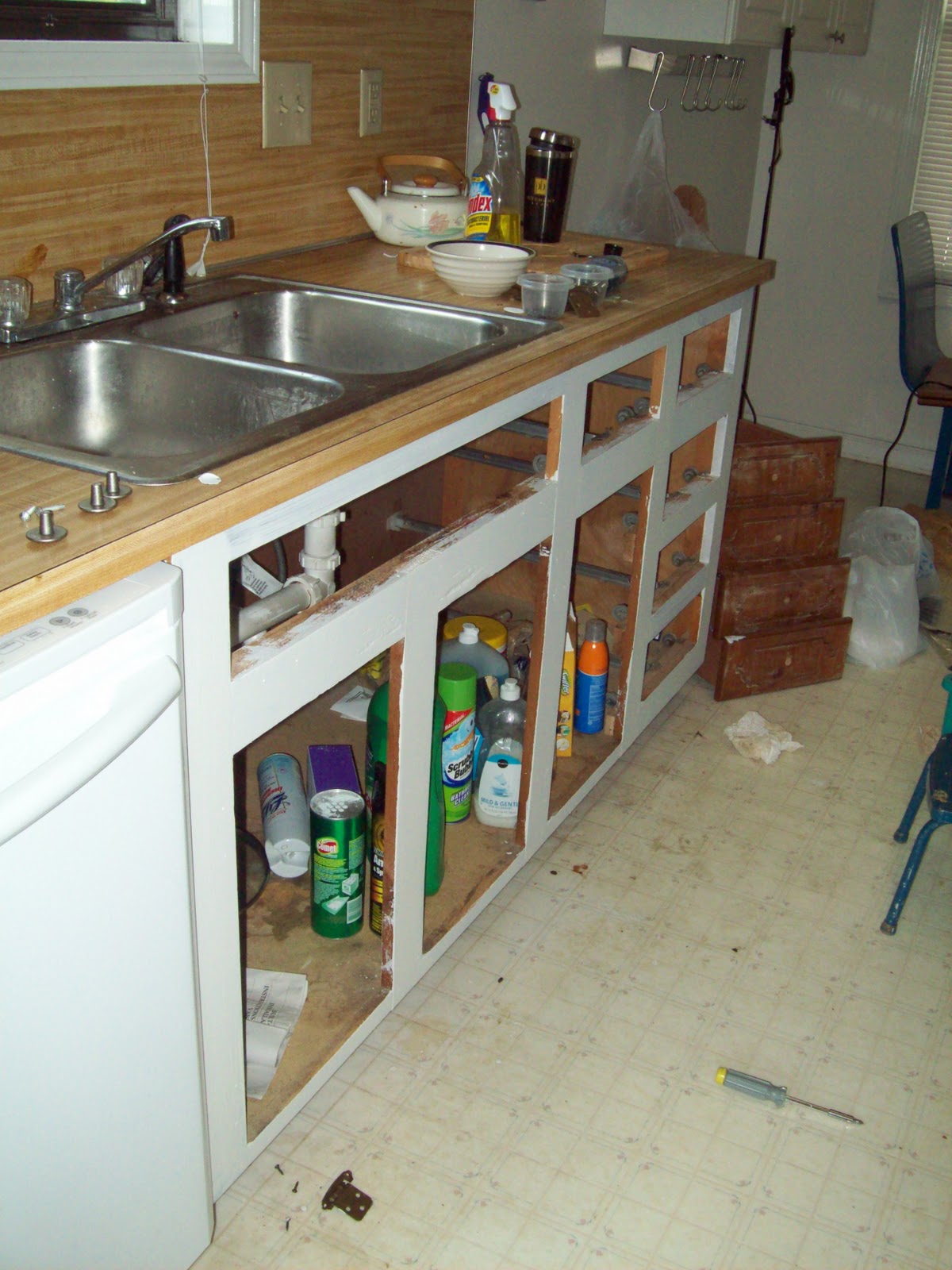 Painting old kitchen cabinets your cabidoors are drying paint cabinets with white primer the oil