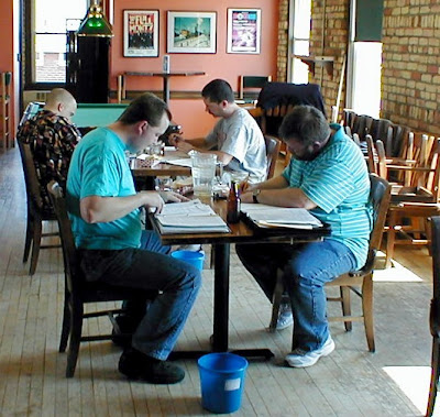 Near table: Judges Dave Taylor and Trevor LaRene. Far table: Judges David Oldenburg and David Siegel