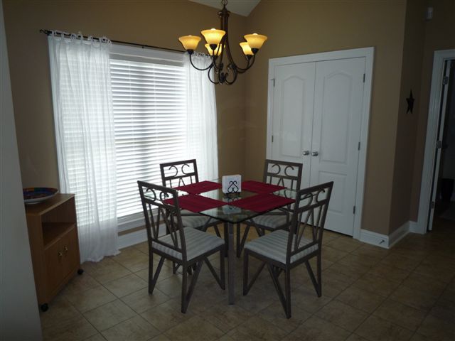 Breakfast Nook, pantry doors in right/center, Laundry Room door at far right (tile in pic replaced)