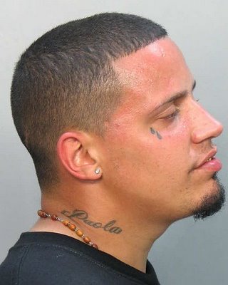 cross tattoo on the neck. Katie Price aka Jordan has a cross tattooed over Peter Andre's name on her