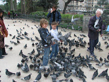 The kids and a couple of birds outside Notre Dame