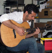 Serj Tankian playing the custom made Loucin guitar