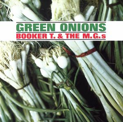 Baby onions tied up with the album title on a white tag. Album cover.