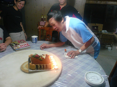 grandfather blowing candles
