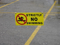 No swimming sign in parking lot