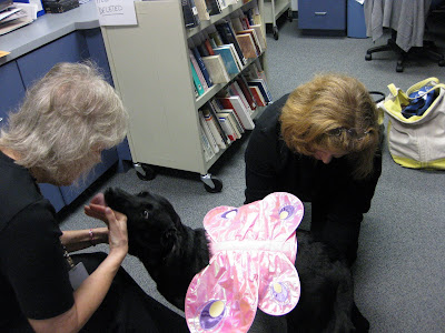 HRH gives Jan a lick as I am tying the bottom ties of the wings.