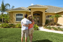 couple in front of house